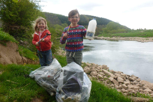 Young volunteers helping clear the river at Luggsmouth.