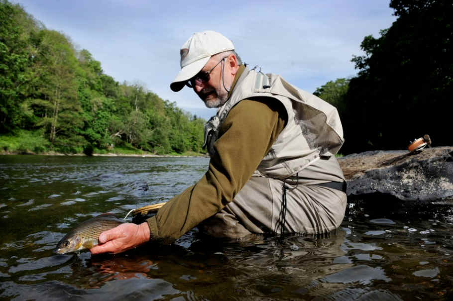 Oliver with a nice August grayling from the upper Wye