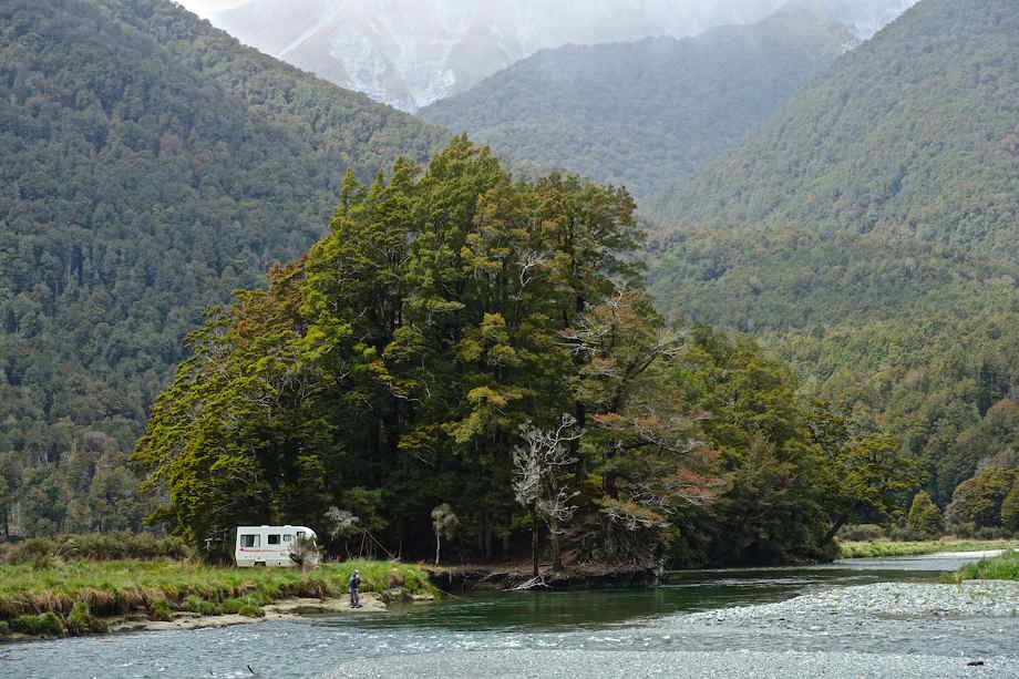 Adam and his campervan in New Zealand