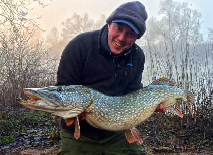 Adam with his mid-twenties pike caught on the first of the two cold days in January.
