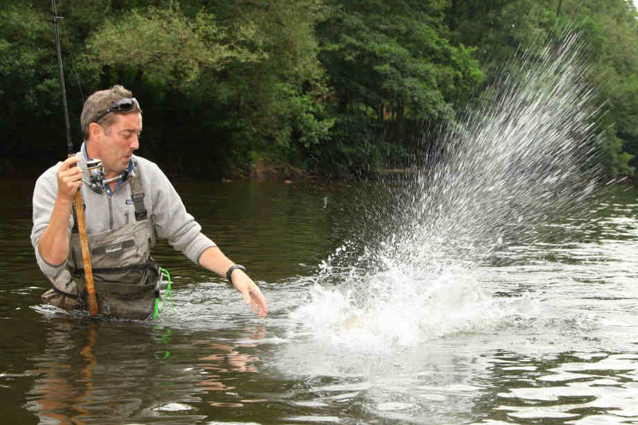 Adam playing a fish