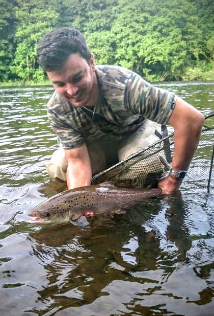 A delighted James Manning with his first ever salmon, 11lb from Gromain on an orange tube fly on the 15th