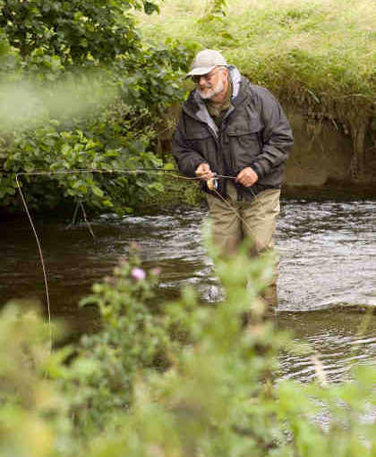 Oliver fishing a small stream with his 7ft rod