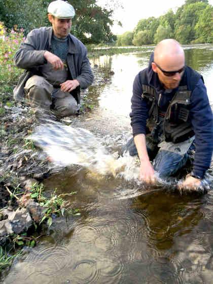Ryan Saxon and Joe Gooch returning the salmon