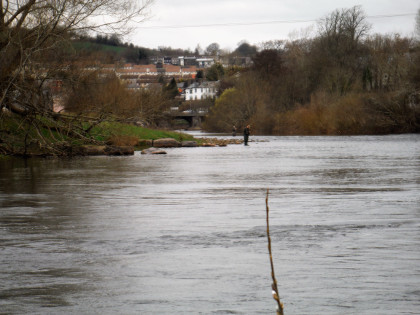 Opening week - anglers on a swollen Usk at Brecon